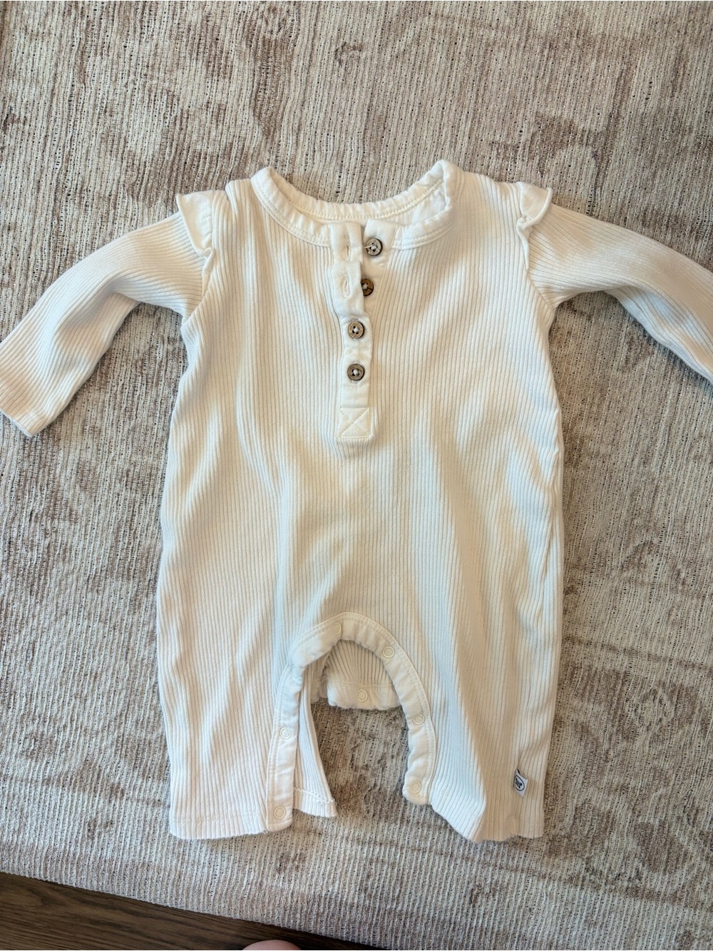 The Honest Company Cream Ribbed Baby Footie One-Piece